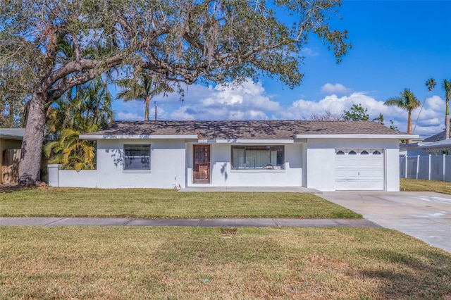 single story home with a front lawn and a garage