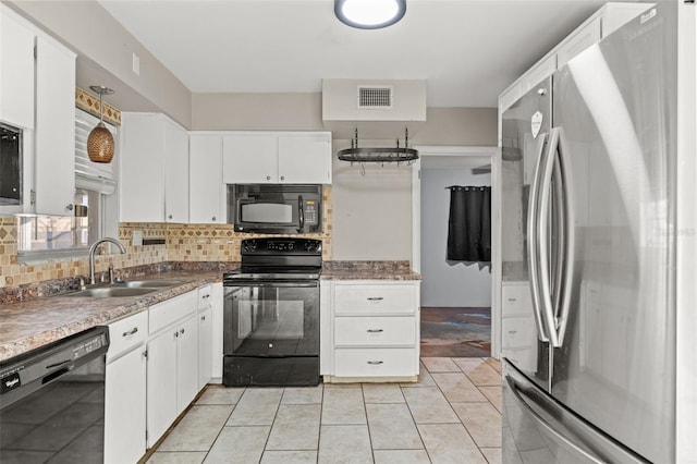 kitchen featuring black appliances, white cabinets, sink, and tasteful backsplash