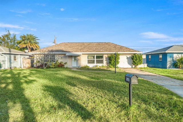 ranch-style house featuring a front yard and a garage