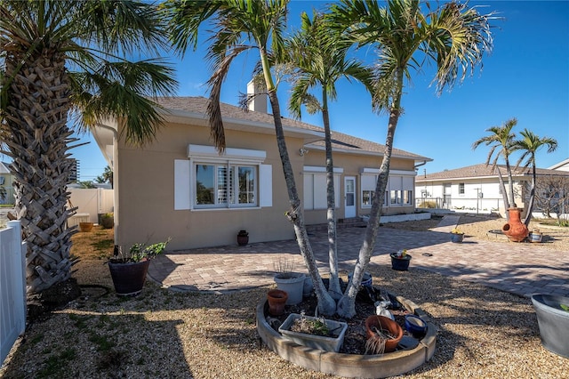 rear view of property featuring a patio