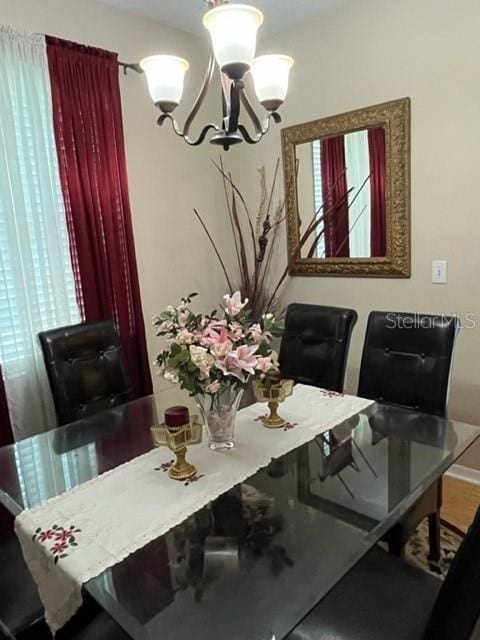 office featuring an inviting chandelier