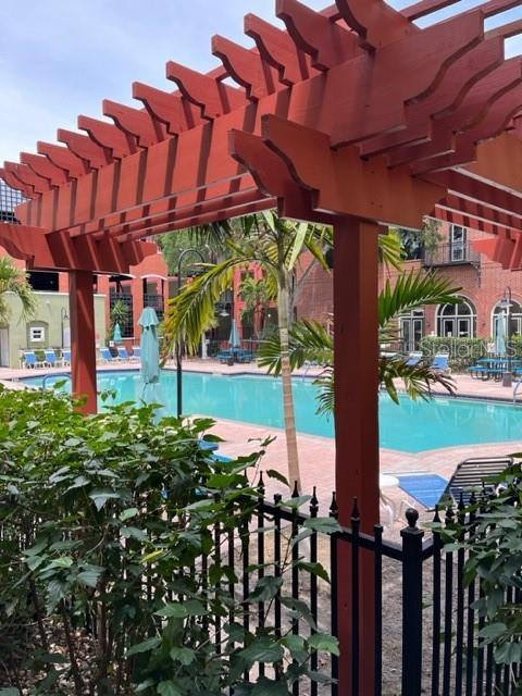 view of swimming pool featuring a pergola