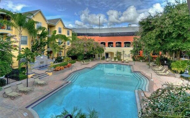 view of swimming pool with a patio area