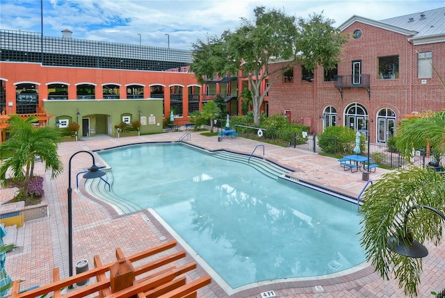 view of swimming pool featuring a patio area