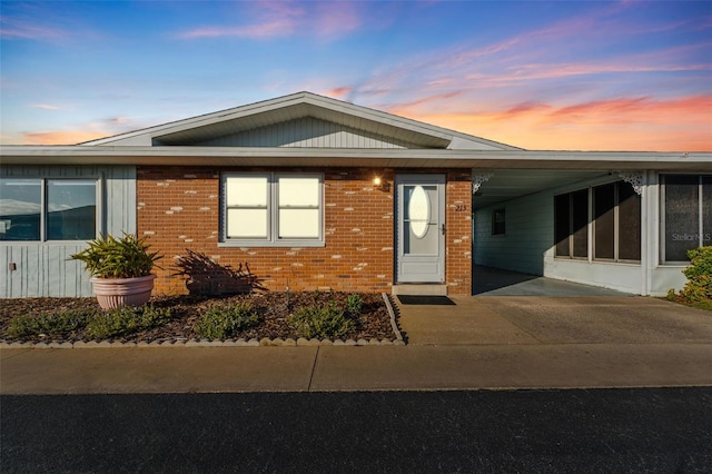 view of front of home with a carport