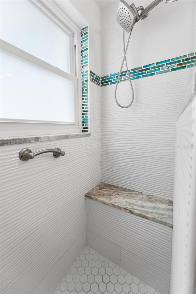 bathroom featuring tiled shower