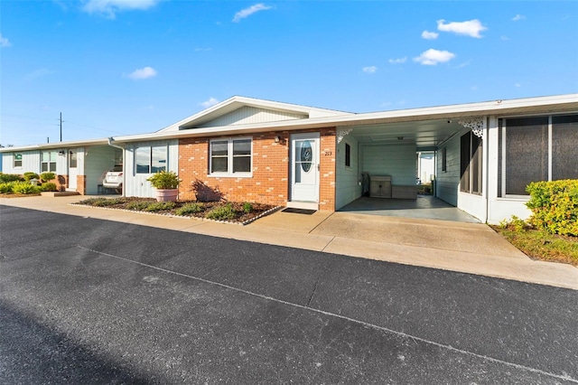 view of front of home with a carport