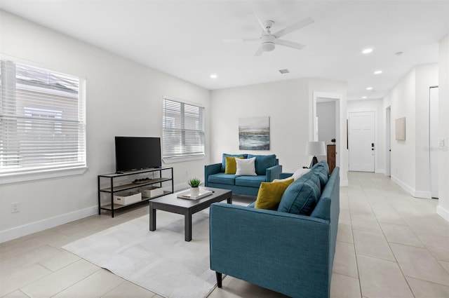 living room featuring ceiling fan and light tile patterned flooring