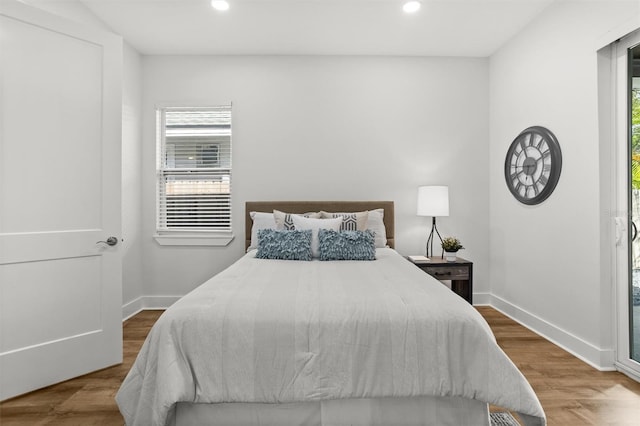 bedroom with hardwood / wood-style flooring