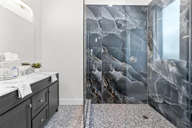 bathroom featuring vanity, an enclosed shower, and a wealth of natural light