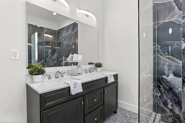 bathroom featuring tile patterned floors, vanity, and a tile shower