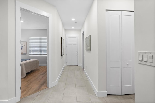 hall with light hardwood / wood-style floors