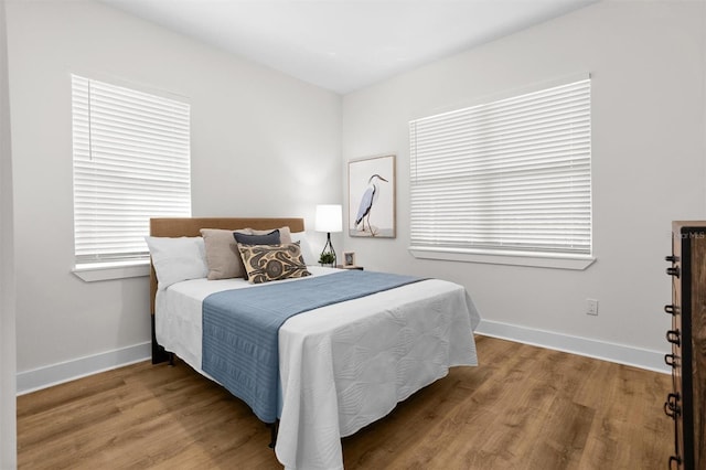 bedroom with hardwood / wood-style flooring