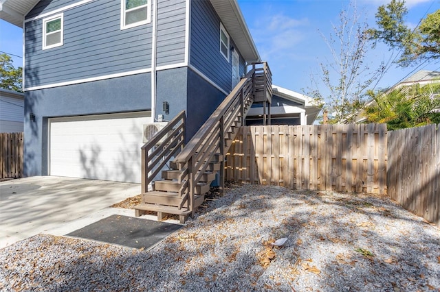 view of property exterior with a garage