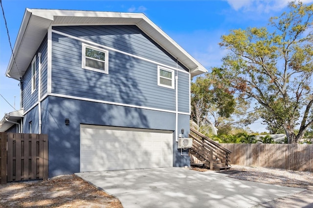 view of side of property featuring a garage