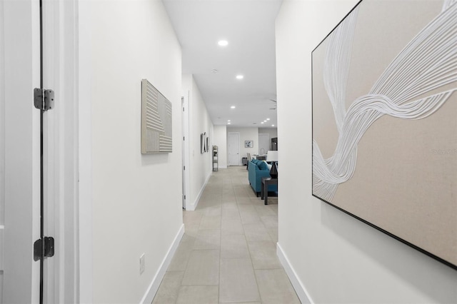 hall with light tile patterned flooring