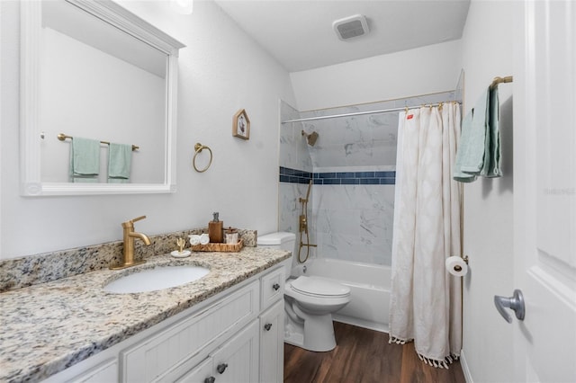 full bathroom featuring hardwood / wood-style floors, vanity, toilet, and shower / bathtub combination with curtain