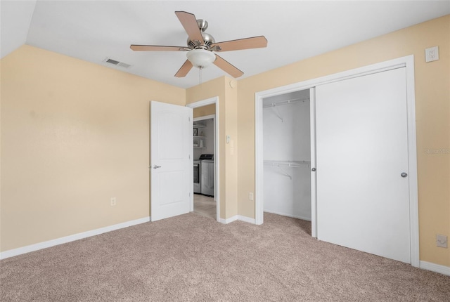 unfurnished bedroom featuring ceiling fan, lofted ceiling, light carpet, and a closet