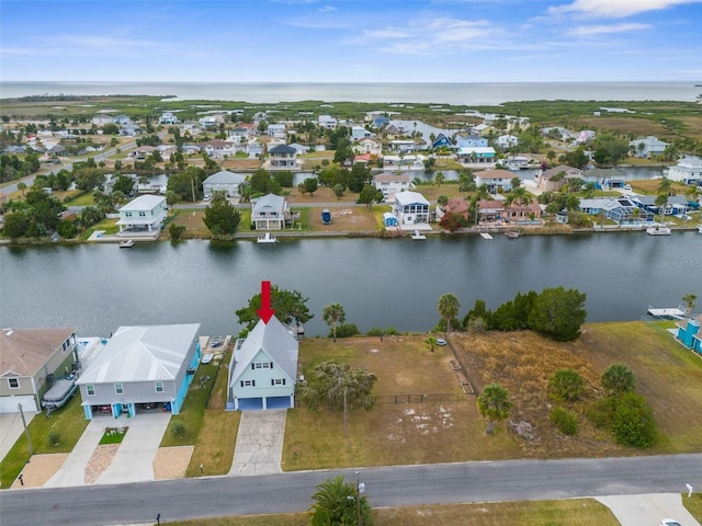 aerial view with a residential view and a water view