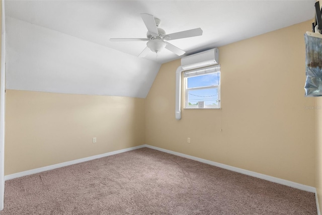 bonus room featuring a wall unit AC, a ceiling fan, carpet flooring, lofted ceiling, and baseboards