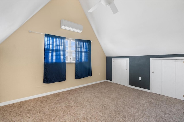bonus room with a ceiling fan, a wall mounted air conditioner, carpet flooring, and lofted ceiling