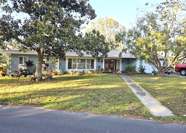 ranch-style house with a front yard