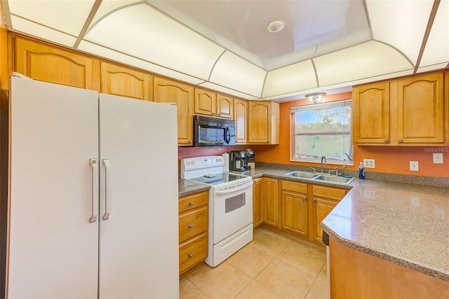 kitchen with sink, light tile patterned floors, and white appliances