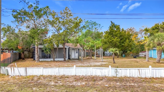 view of yard with a sunroom