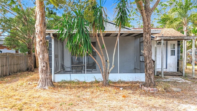 exterior space featuring a sunroom