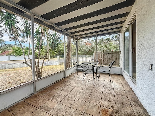 unfurnished sunroom featuring plenty of natural light