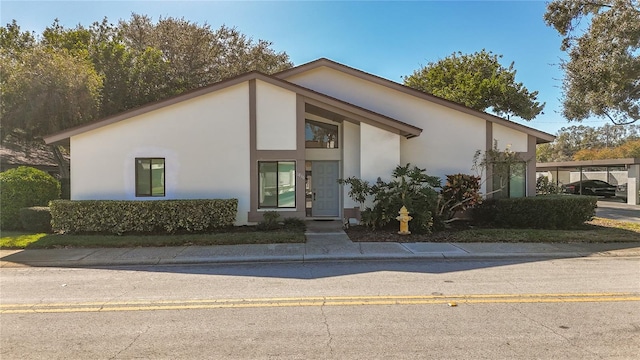 view of front of home with a carport