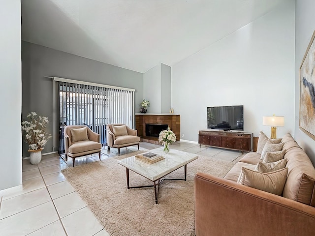 living room featuring light tile patterned floors and vaulted ceiling