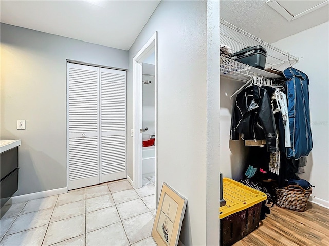 mudroom featuring light tile patterned flooring