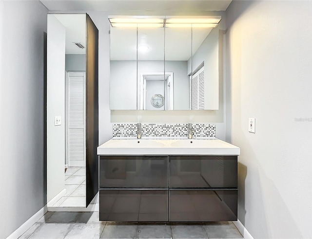 bathroom featuring backsplash and vanity