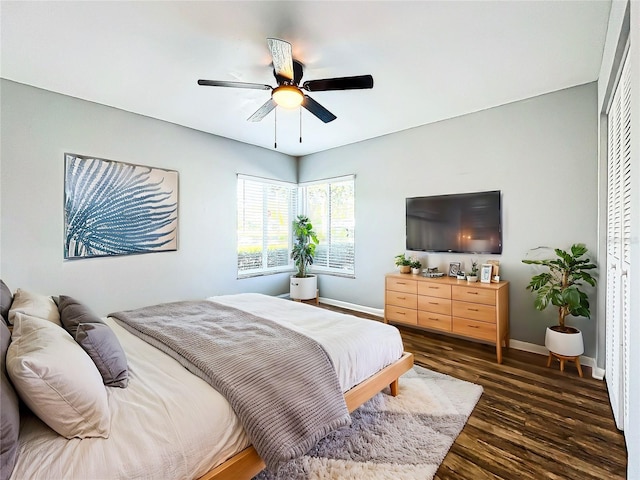 bedroom featuring ceiling fan and dark wood-type flooring