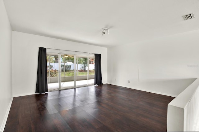 unfurnished room with wood-type flooring