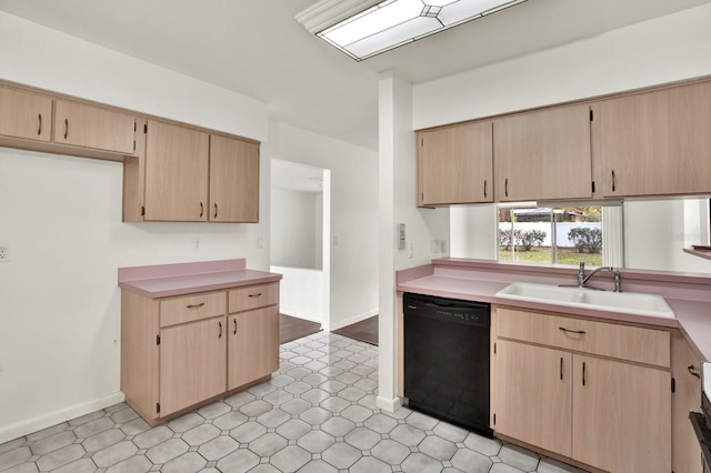 kitchen featuring light brown cabinetry, black dishwasher, and sink