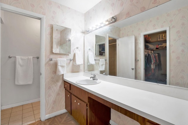 bathroom with tile patterned flooring and vanity