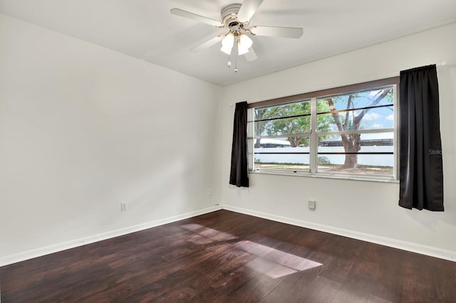 spare room with wood-type flooring and ceiling fan