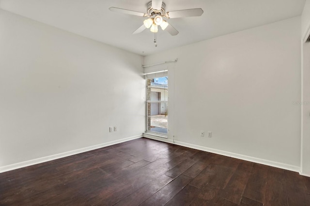 empty room with dark hardwood / wood-style floors and ceiling fan