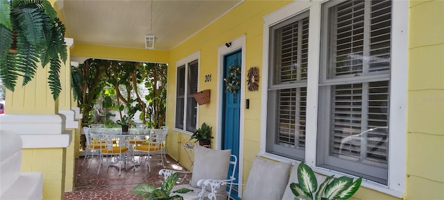 doorway to property featuring covered porch