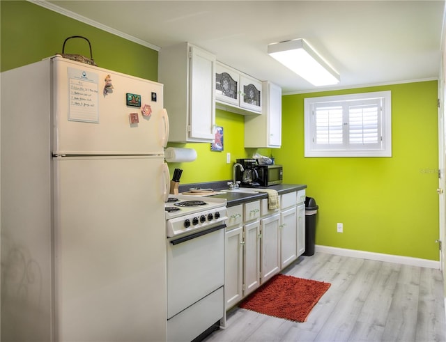 kitchen featuring white cabinets, light wood-type flooring, white appliances, and ornamental molding