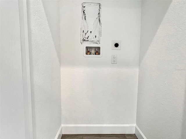 laundry area featuring wood-type flooring, hookup for a washing machine, and electric dryer hookup