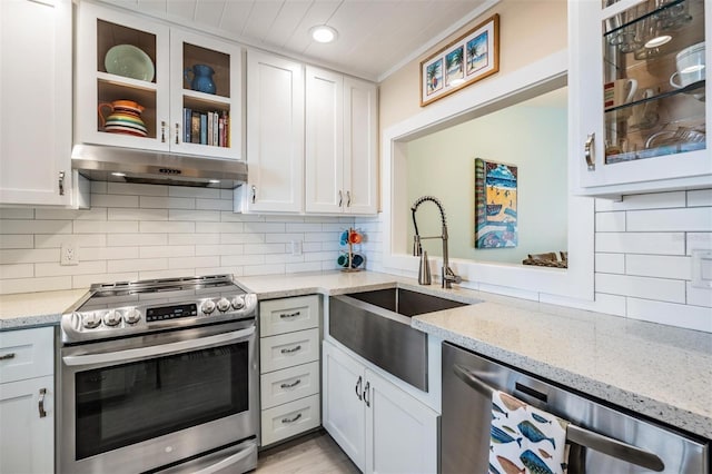 kitchen featuring appliances with stainless steel finishes and white cabinetry