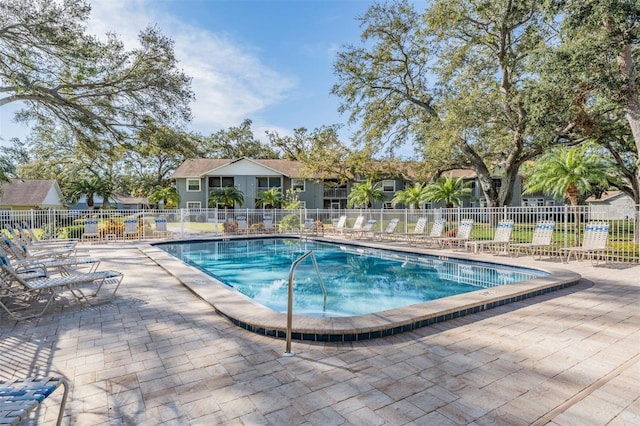 view of swimming pool featuring a patio area