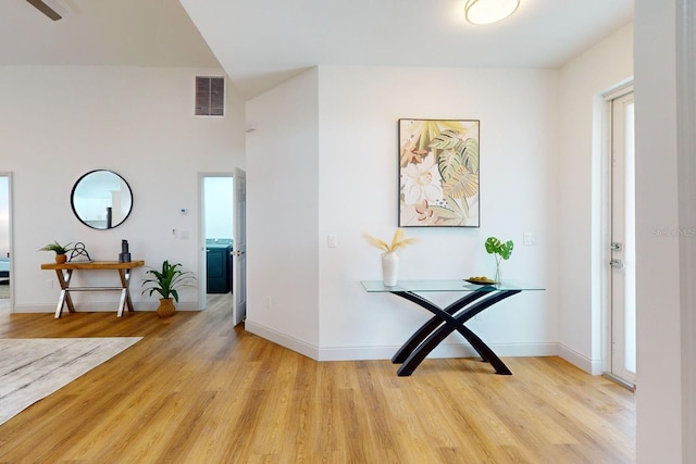 hall with light hardwood / wood-style flooring