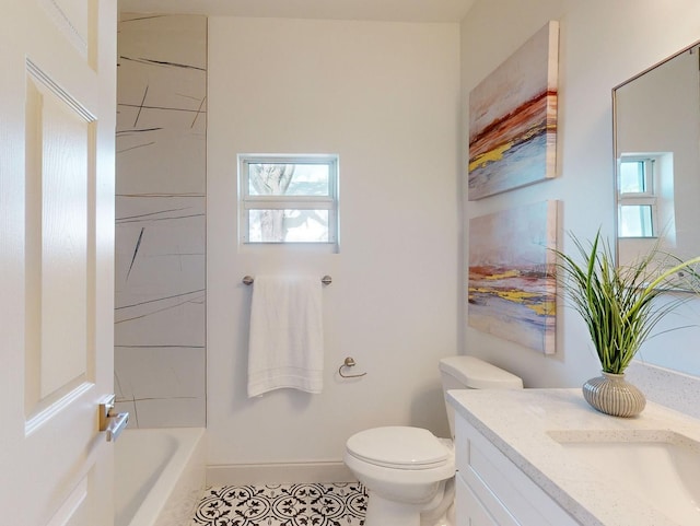 bathroom with tile patterned floors, vanity, and toilet