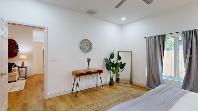 bedroom featuring ceiling fan and light hardwood / wood-style floors