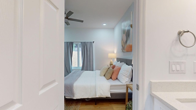 bedroom featuring ceiling fan and hardwood / wood-style floors