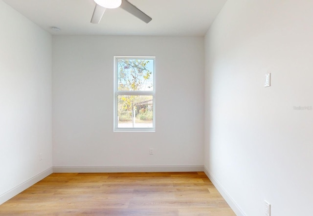 spare room with light hardwood / wood-style flooring